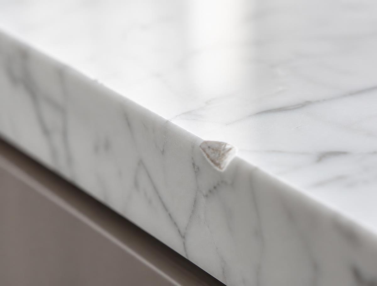 Marble benchtop with a chipped edge before repair